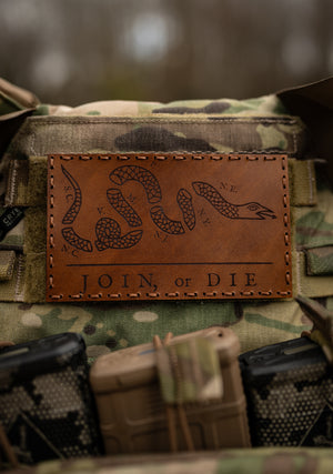 join or die brown leather on a camo carrier