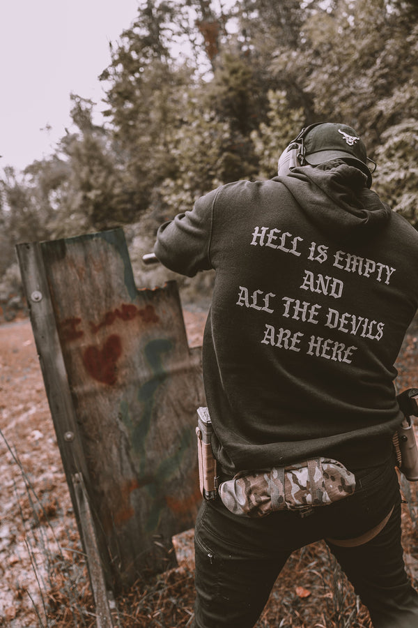man in woods wearing a great sweatshirt with gray text
