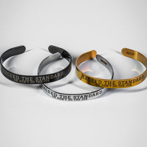 Three stainless steel bracelets with motivational text on a white background