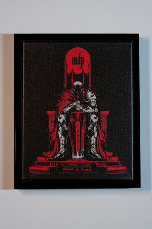 Framed canvas art with a red and black design of a figure on a throne, featuring the logo 'mdp'.